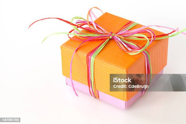 Lovely Orange And Pink Present Stock Photo - Download Image Now - Adult, Backgrounds, Beautiful People