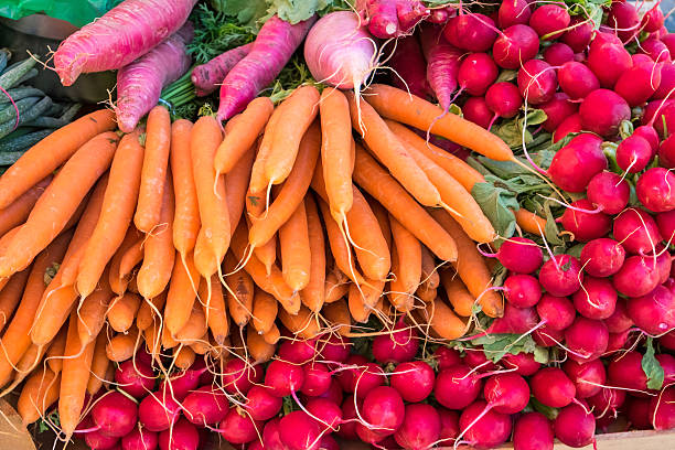 istock Carrots and radish for sale 487085190