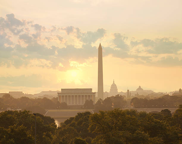 istock Washington DC skyline with sun and clouds in the morning 487085778