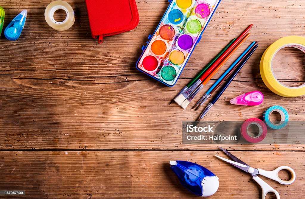 Back to school composition Desk with stationary and with Back to school sign. Studio shot on wooden background. Art And Craft Stock Photo