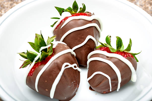 istock Strawberries covered  in chocolate in a white bowl 487087500