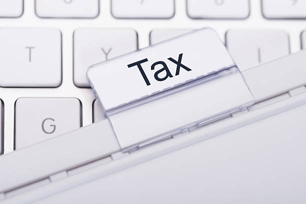 istock Tax Tab Attached To Keyboard 487097160
