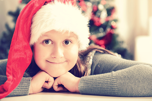 girl in the hat of Santa Claus