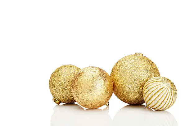 Gold Christmas balls on white background. White copy space for your text and logo.