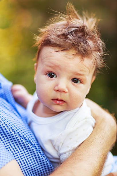 istock shaggy baby boy, close-up, summer 487103172