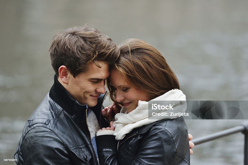 Lovely couple enjoying fall in love at park 20-29 Years Stock Photo