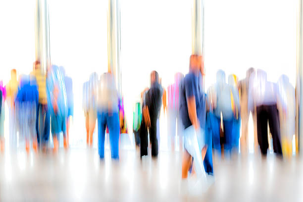 istock Large Group of Blurred, Unrecognizable People 487107662