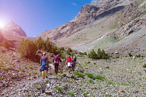 istock Group of people walking on trail 487109046