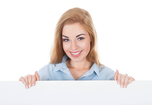 istock Smiling Woman Holding Placard 487109502