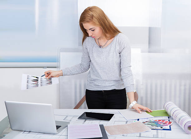 istock Young Woman Working At Office Desk 487109504