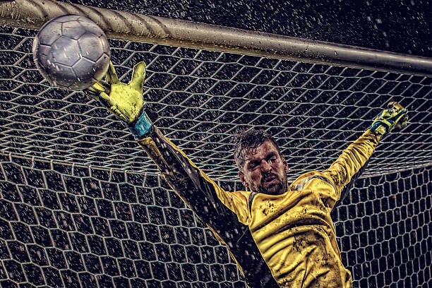 istock Goalkeeper diving to save goal 487113746