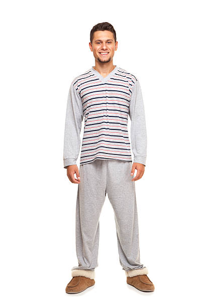istock young man   in pajamas 487114266