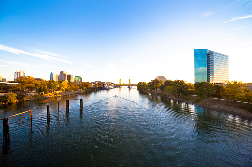 View at downtown Sacramento and West Sacramento from a Sacramento River bridge. Late afternoon in autumn.