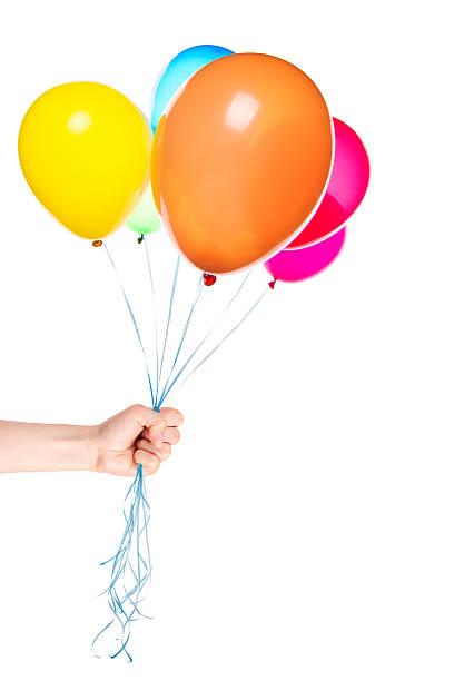 istock human hand gives flying balloons 487120829
