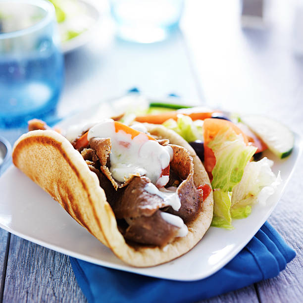 greek gyro platter lamb gyro with greek salad and tzatziki sauce greek food stock pictures, royalty-free photos & images