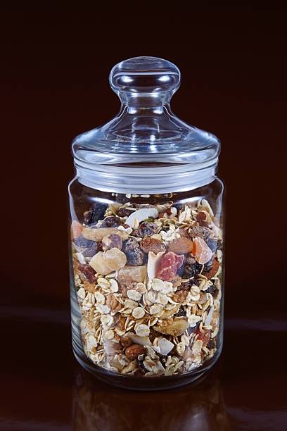 Breakfast cereals, oatmeal with candied fruits and nuts, glass jar
