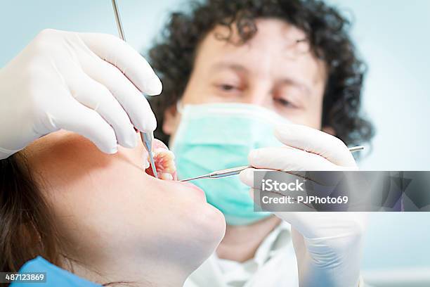 Dentist With Dental Tools Stock Photo - Download Image Now - 20-24 Years, 40-44 Years, Adult