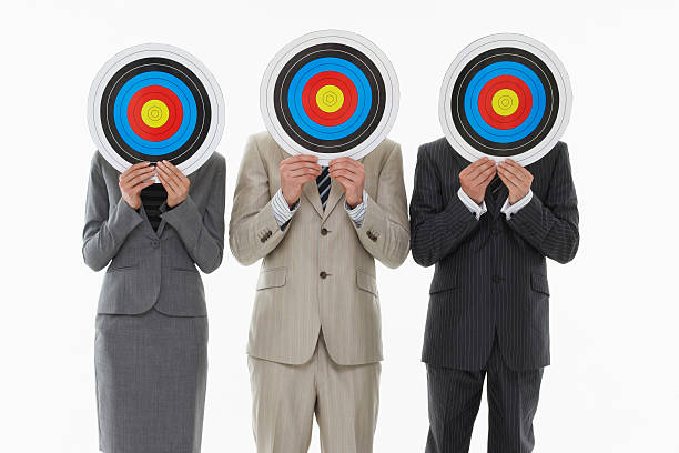 istock Businesspeople Holding Targets In Front Of Faces 487124991