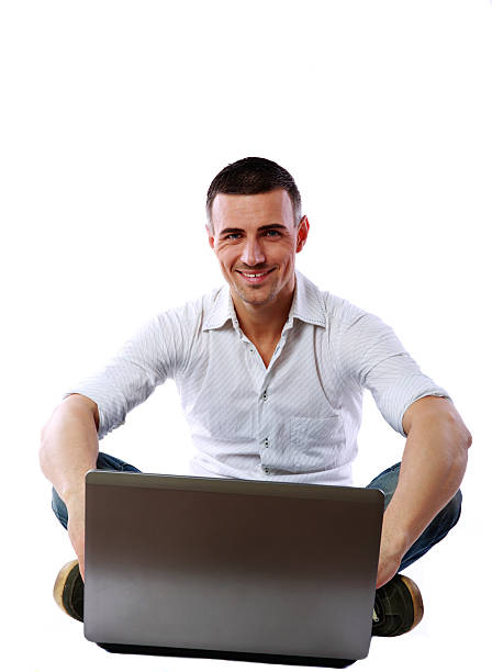 istock man sitting at the floor with laptop 487126555