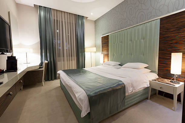 istock Beautiful luxury hotel double bed room 487126761