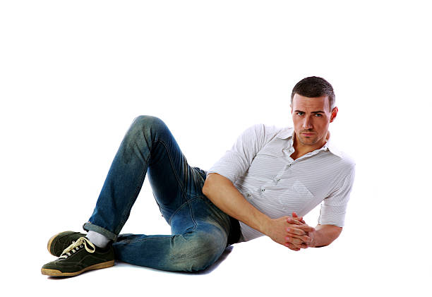 istock Confident man laying on the floor 487127289