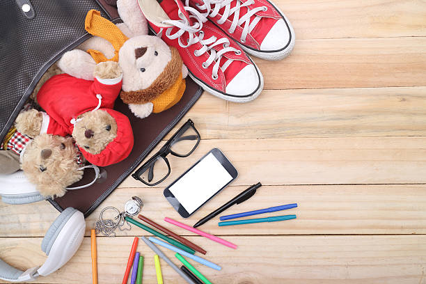 istock overhead of office table or student table with smartphone. 487129756