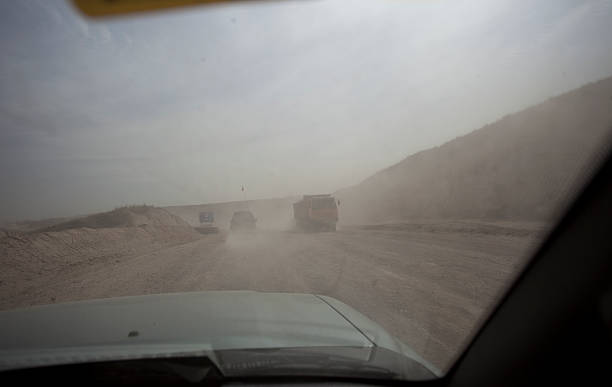 istock Dirty windshield showing car running at high polluted area 487130910