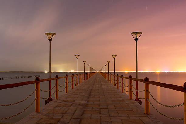 istock wood bridge to sea 487131380