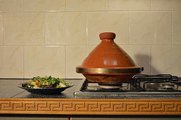 White rice in a traditional Sri Lankan clay pot. Set in a collection of pots.