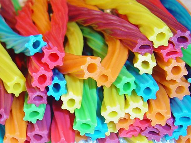 Licorice wands stacked up stock photo