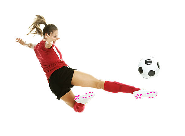 istock Female soccer player kicking the ball 487133948