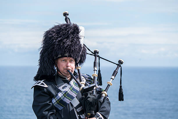 istock Traditional scottish bagpiper at the sea 487140086