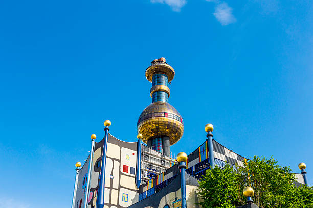 Vienna, Austria - April 28, 2015: Tower of Garbage-processing plant in Vienna, Austria. Designed by Friedensreich Hundertwasser. It was inaugurated in 1992 and heats 60000 apartments.