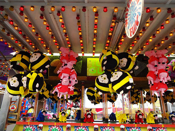 Ocean City, USA-September 2, 2015: These lights and plush arcade toys were spotted at the Boardwalk in Ocean City Maryland. A game of chance is played to win one though odds are in favor of the arcade. The boardwalk features restaurants, clothing stores, arts and crafts as well as amusement park rides. 
