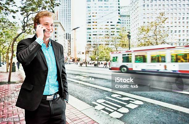 Smiling Businessman On Mobile Outdoors Stock Photo - Download Image Now - 2015, Adult, Architecture