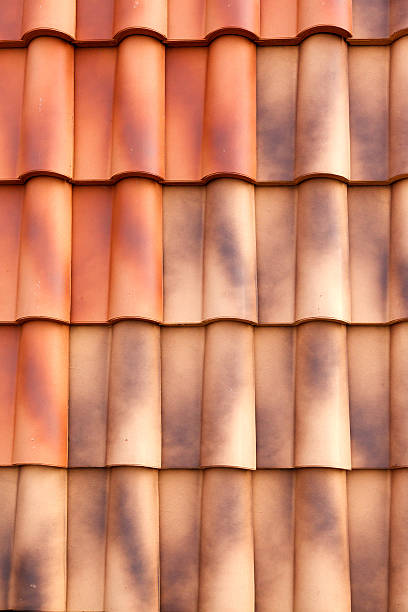 istock Red tiles roof background 487154311