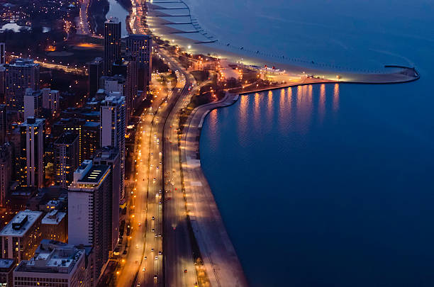 Gold Coast after sunset Aerial view of Lake Shore Drive and North Avenue Beach at dusk in Chicago, Illinois, USA, in spring lake shore drive chicago stock pictures, royalty-free photos & images