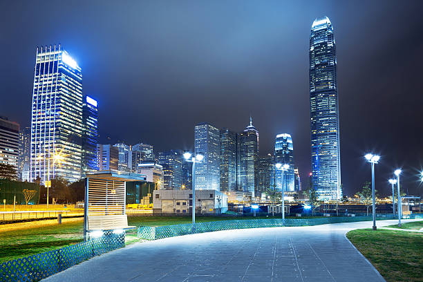 istock pathway in the night with modern city background 487155113