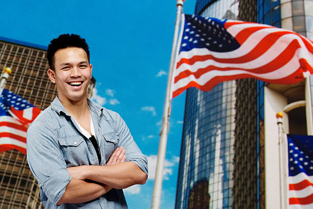 istock Smiling man standing in front of city 487156085