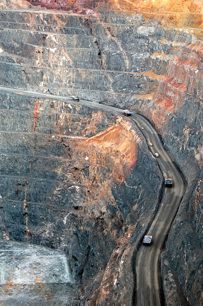 istock Trucks in Super Pit gold mine Australia 487156604