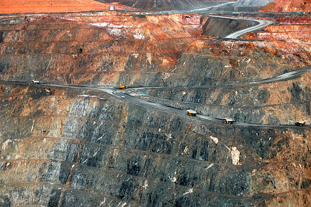 istock Trucks in Super Pit gold mine Australia 487156608