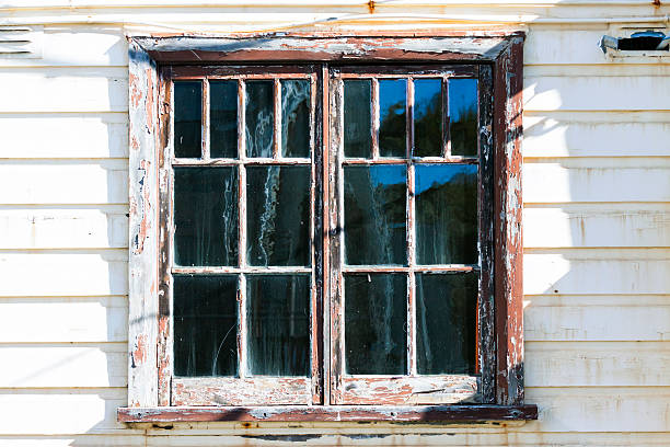 erosion of paint at old window
