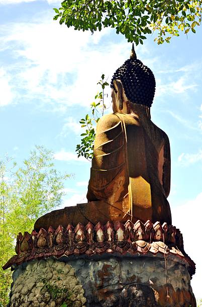 istock Back of Buddha statue against blue sky 487157121