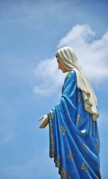 istock Mother mary statue on blue sky 487157319