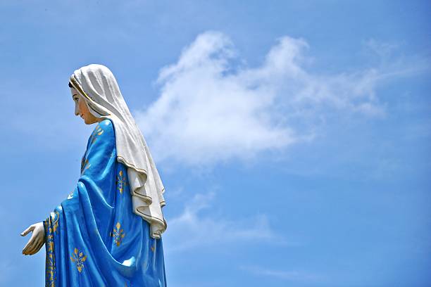 istock Mother mary statue on blue sky 487157321