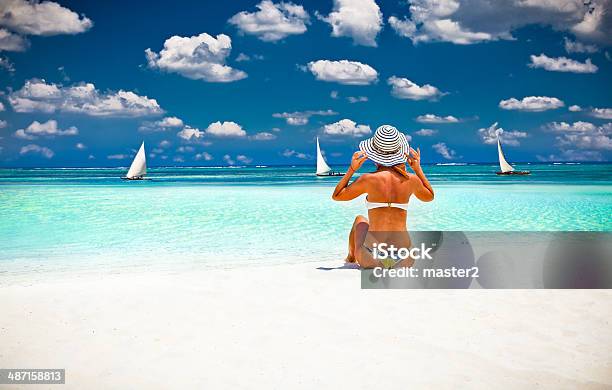 Woman Relax On The Beautiful Tropical Beach Stock Photo - Download Image Now - Zanzibar, Beach, Sand