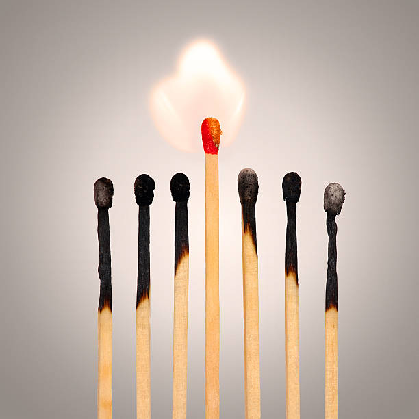 istock burned matches row with one flame - team leader concept 487158929