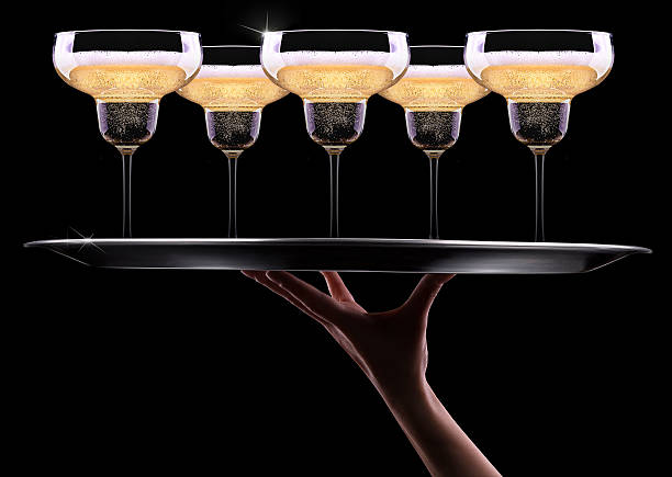 istock waiter hand with champagne 487159863