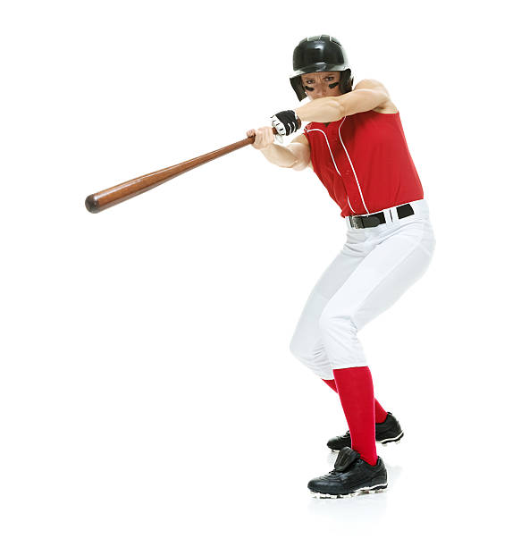 istock Female baseball player batting 487163104