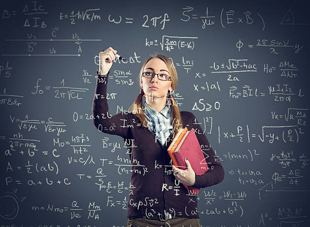 istock Student girl writing formulas on transparent wall 487163900